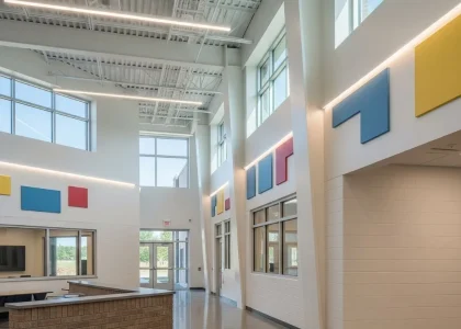 Bright modern school interior with open, colorful spaces.